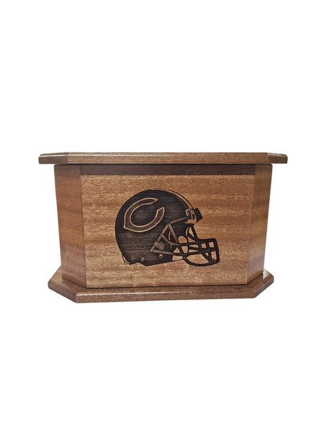 A wooden box with a carved image of a football helmet on it.