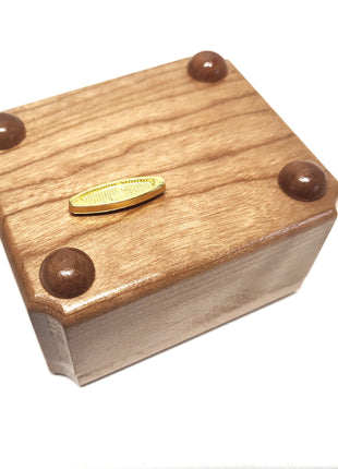 a wooden box with some chocolates in it
