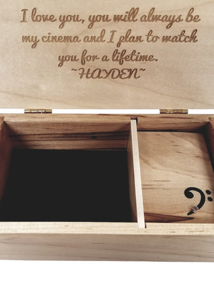 a wooden box with a musical note inside of it