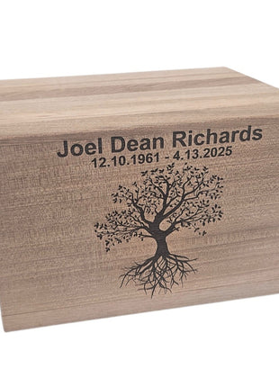 A wooden box with a tree design and the text "Joel Dean Richards 12.10.1961 - 4.13.2025" engraved on it.