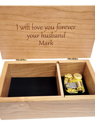 a wooden box with a note inside of it