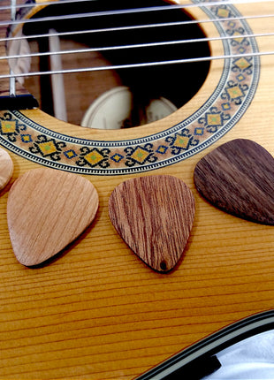 a close up of a guitar's frets and strings