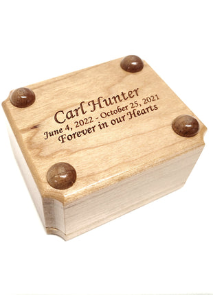 a wooden box with some chocolates in it