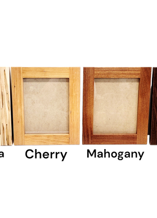 a group of four wooden frames sitting next to each other