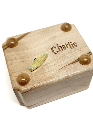 a wooden box with a name on it