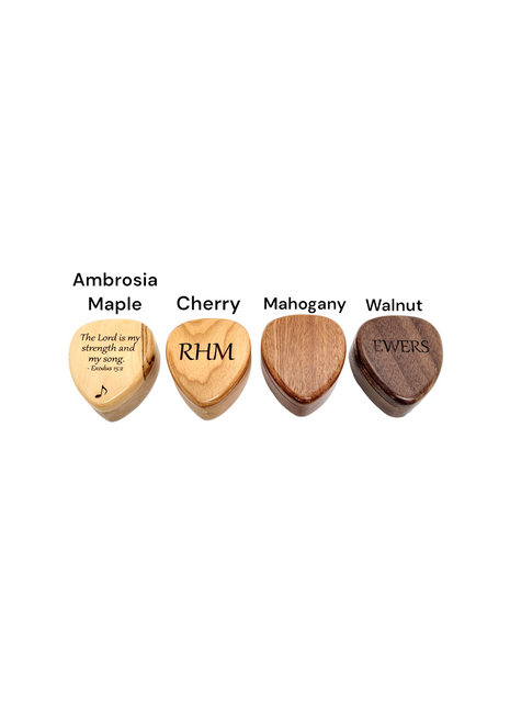 a set of four wooden guitar picks with names on them