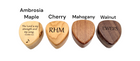 a set of four wooden guitar picks with names on them