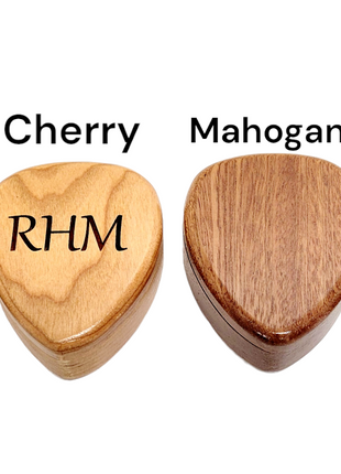 a set of four wooden guitar picks with names on them