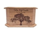 A wooden box with a tree engraved on it, featuring the text 