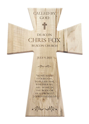 The image is a wooden cross with a message engraved on it.