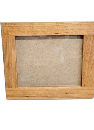 A simple wooden frame with a blank canvas inside, set against a white background.