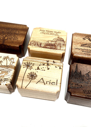 a group of four wooden stamps sitting on top of each other