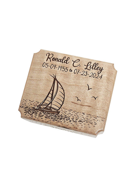 The image is a wooden plaque with a sailboat and waves engraved on it.