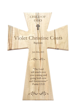 The image is a wooden cross with a Bible verse engraved on it.
