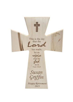 A wooden cross with a Bible verse and a personalized message for Susan Griffin, who is celebrating her retirement.