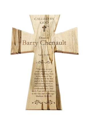 The image is a wooden cross with a message engraved on it.